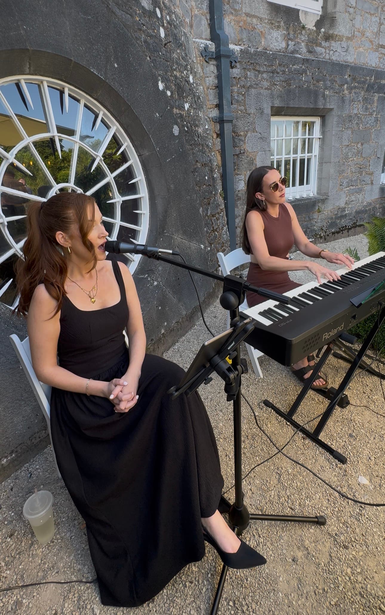 Saoirse performing with a keyboard player at a wedding venue